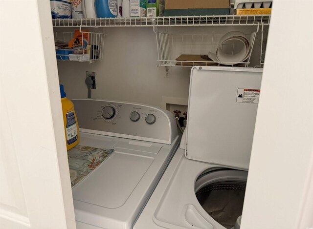 laundry area with independent washer and dryer