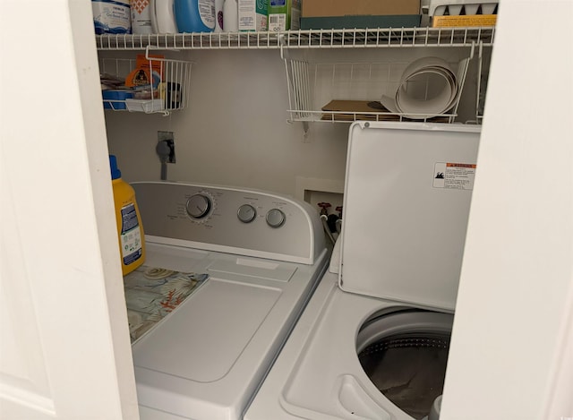 clothes washing area featuring washing machine and dryer