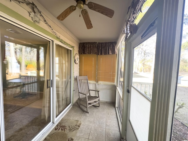 sunroom / solarium with ceiling fan