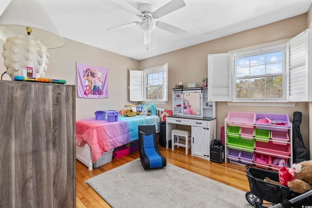 bedroom with hardwood / wood-style flooring and ceiling fan