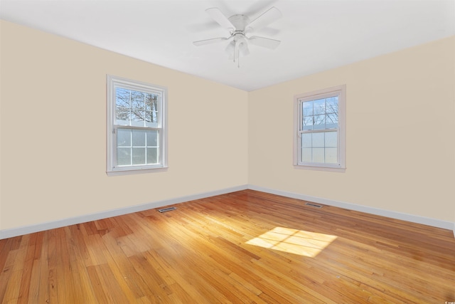 empty room featuring ceiling fan and wood-type flooring