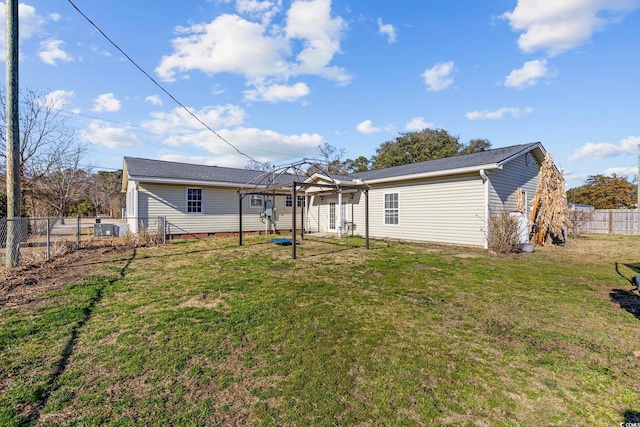 rear view of house featuring a yard and a gazebo