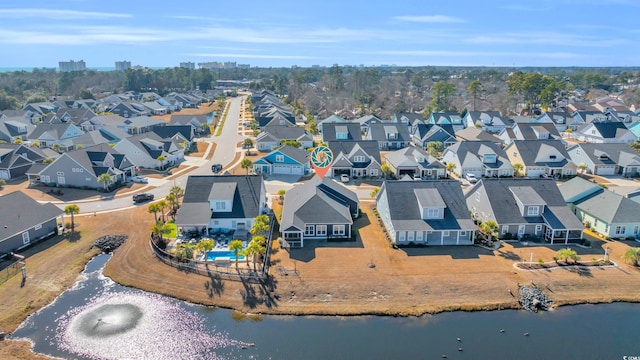 birds eye view of property featuring a residential view and a water view