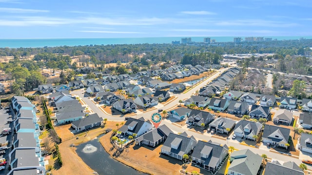 aerial view with a water view and a residential view