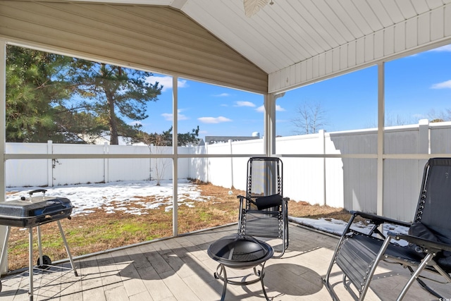 unfurnished sunroom with vaulted ceiling