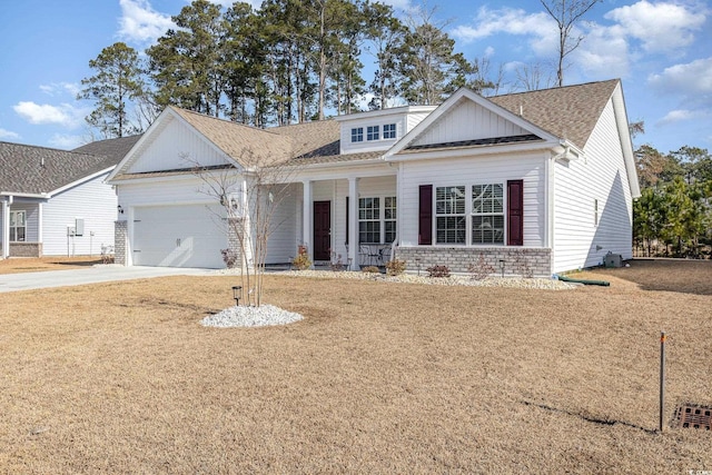 view of front of house with a garage and a front yard