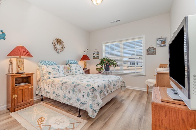 bedroom with light wood-type flooring