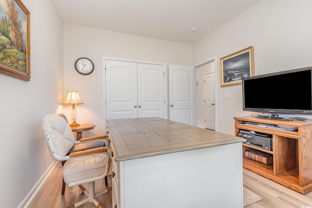 office area with light hardwood / wood-style flooring