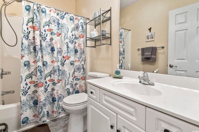 full bathroom with vanity, toilet, and shower / tub combo