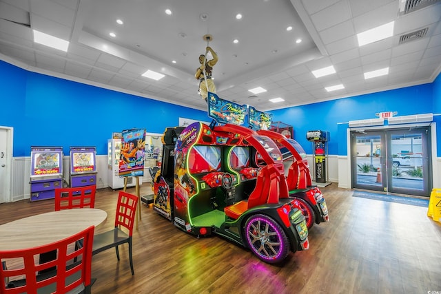 playroom featuring hardwood / wood-style flooring and a paneled ceiling