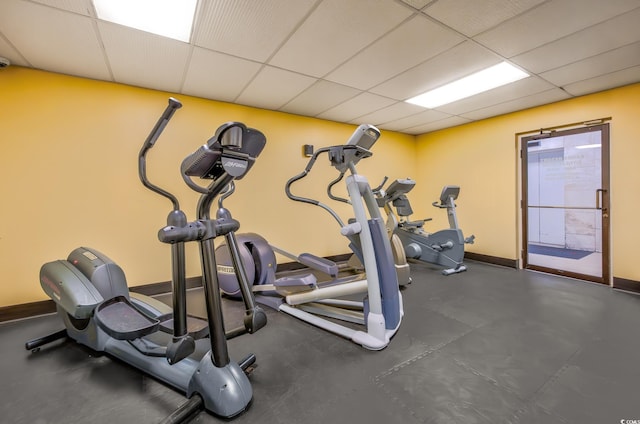 workout room featuring a paneled ceiling