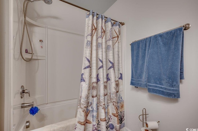 bathroom with shower / bath combination with curtain