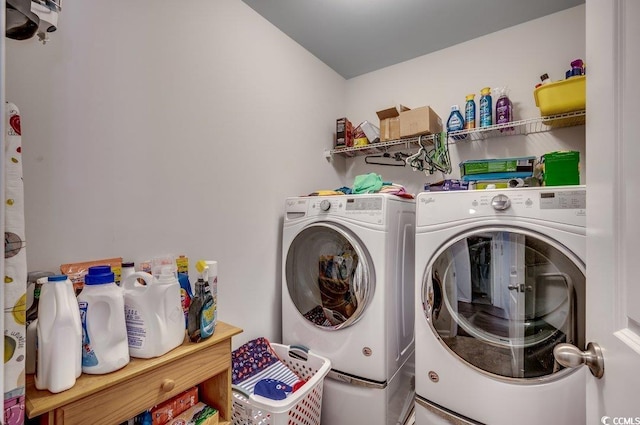 clothes washing area featuring separate washer and dryer