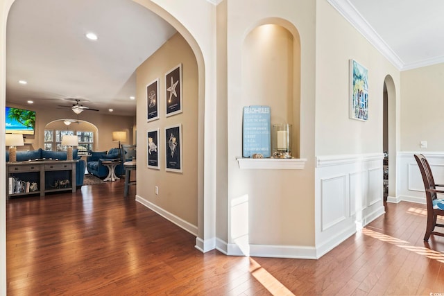 corridor featuring crown molding and wood-type flooring