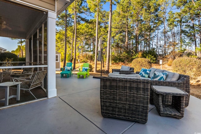 view of patio / terrace with an outdoor living space and ceiling fan