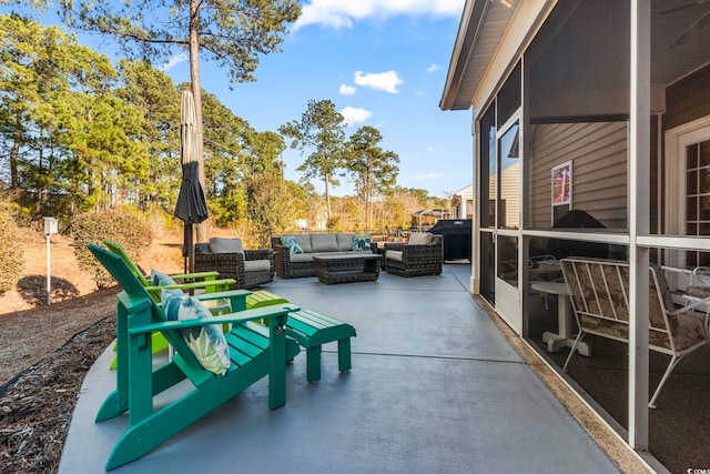 view of patio / terrace featuring outdoor lounge area and a sunroom