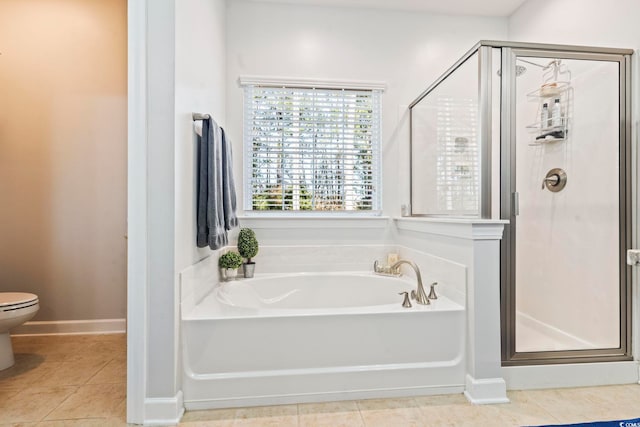 bathroom with shower with separate bathtub, tile patterned floors, and toilet