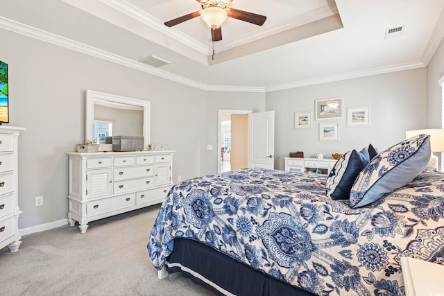 bedroom with a raised ceiling, ornamental molding, light colored carpet, and ceiling fan