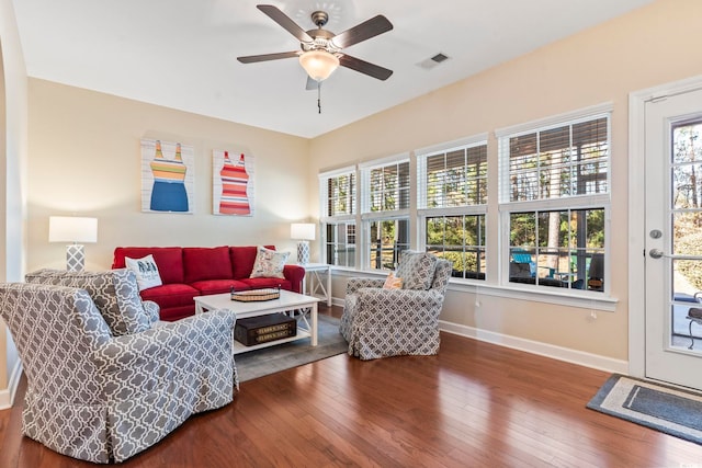 living room featuring ceiling fan and hardwood / wood-style floors