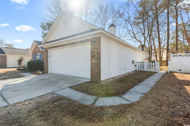 view of side of property featuring a garage