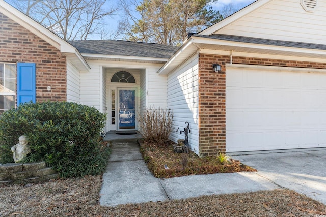 doorway to property featuring a garage