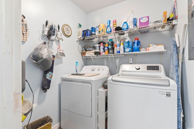 clothes washing area featuring separate washer and dryer