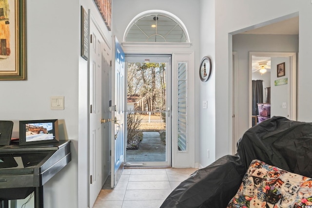 foyer featuring light tile patterned flooring