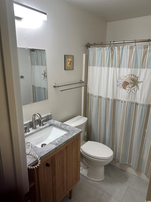 full bath featuring toilet, tile patterned floors, and vanity