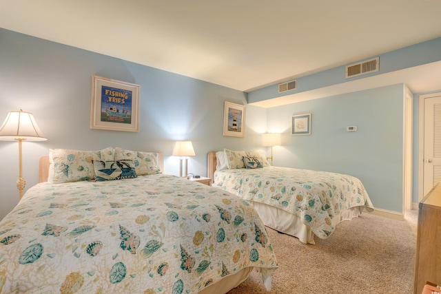 bedroom featuring carpet and baseboards