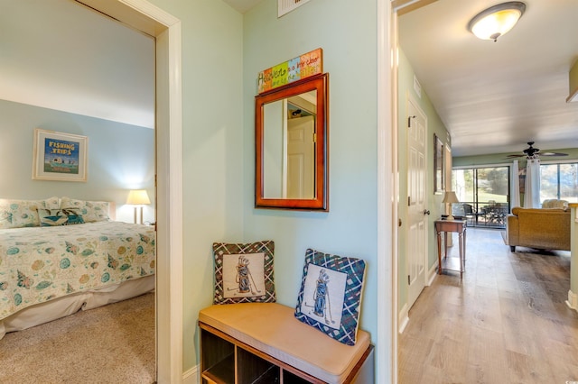 corridor featuring wood finished floors
