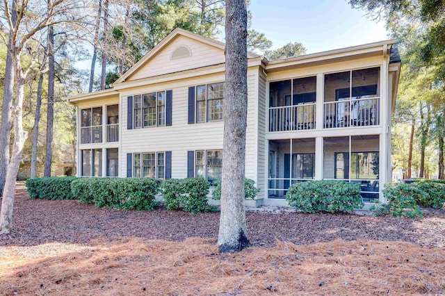 view of front of home with a sunroom