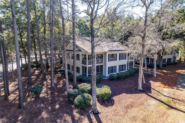 view of property exterior featuring a sunroom