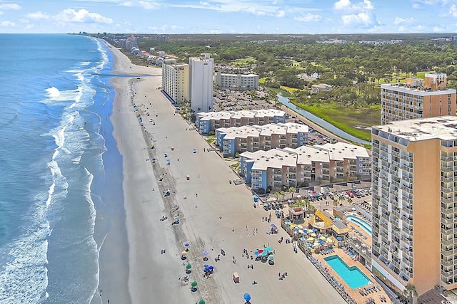 birds eye view of property with a view of the beach and a water view