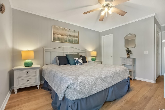 bedroom featuring crown molding, light hardwood / wood-style floors, and ceiling fan