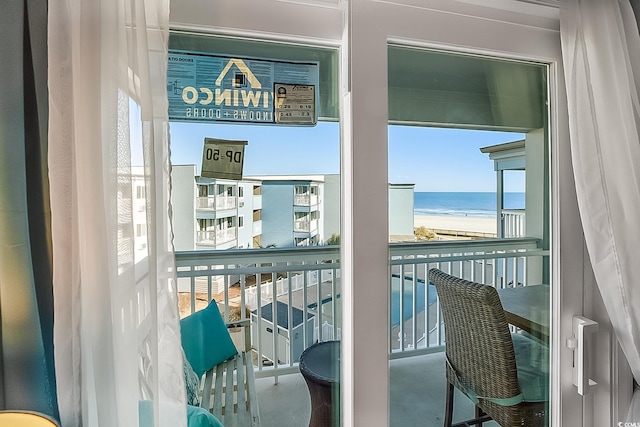 balcony with a view of the beach and a water view