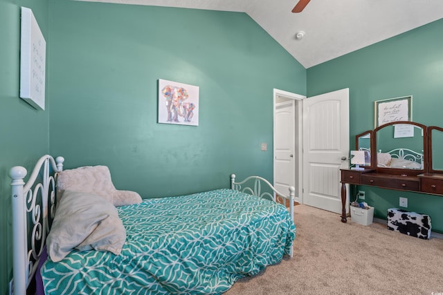 bedroom with vaulted ceiling, carpet flooring, and ceiling fan