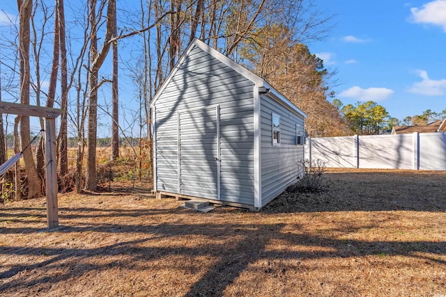 view of shed with fence