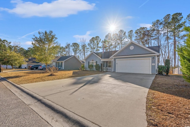 single story home featuring a garage and driveway