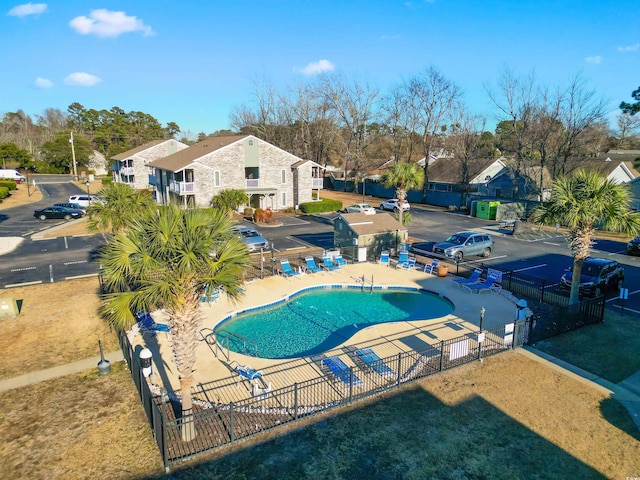 view of swimming pool with a yard and a patio area