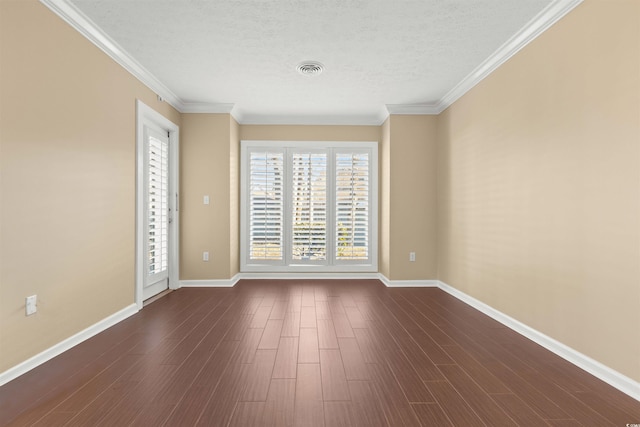 unfurnished room with ornamental molding, dark hardwood / wood-style floors, and a textured ceiling