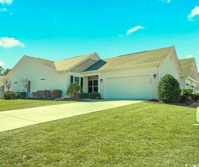 ranch-style house featuring an attached garage, concrete driveway, and a front yard