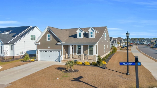 view of front facade with a garage and a porch