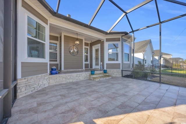 view of patio with a lanai