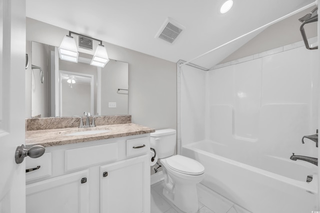 full bathroom featuring vanity, vaulted ceiling, tub / shower combination, and toilet