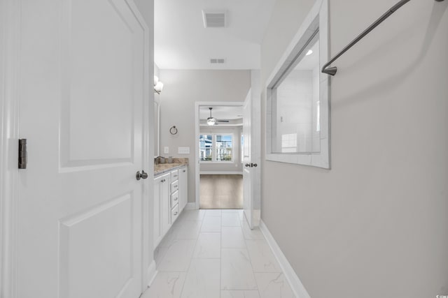 bathroom featuring vanity and ceiling fan