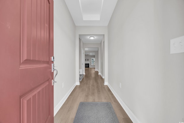 corridor with light wood-type flooring