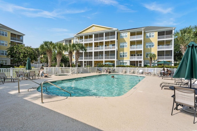 view of swimming pool featuring a patio area