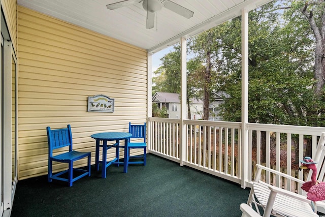 sunroom / solarium featuring ceiling fan