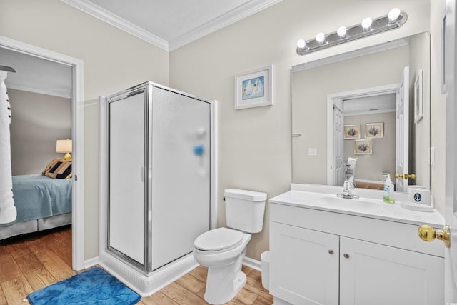 bathroom featuring hardwood / wood-style flooring, ornamental molding, an enclosed shower, and vanity