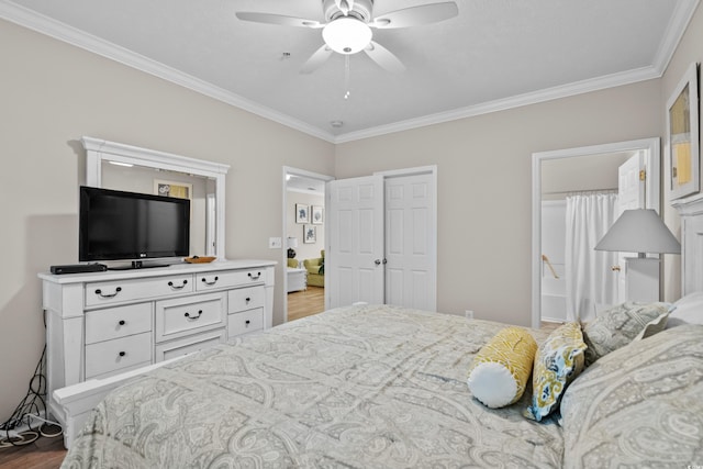 bedroom featuring hardwood / wood-style floors, ornamental molding, and ceiling fan